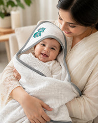 Close up of the teal fish embroidery on the towel hood