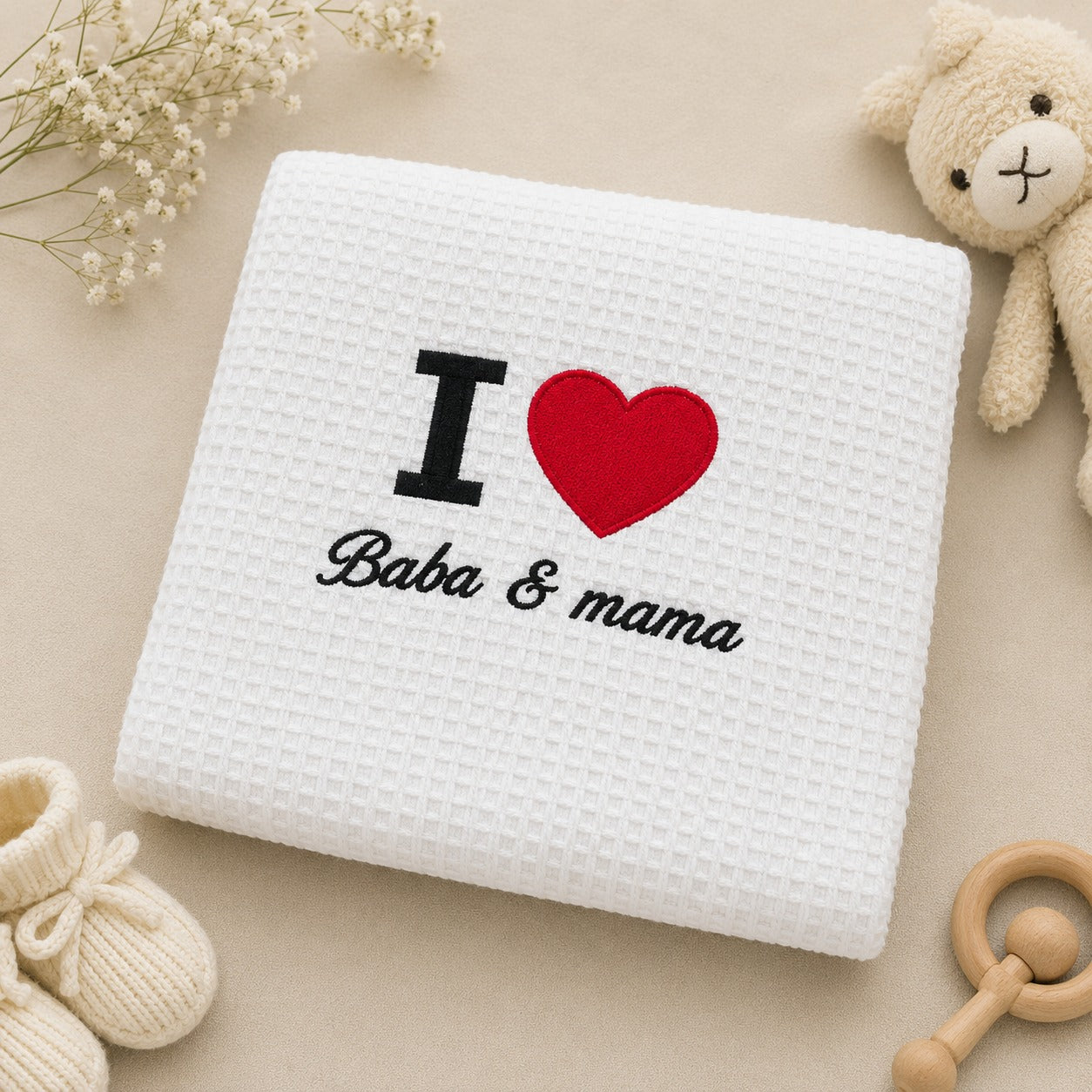 I Love Baba and Mama embroidered white waffle baby blanket, folded