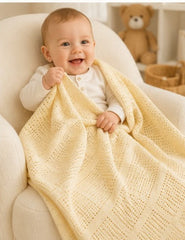 Baby wrapped in lemon cellular cotton blanket