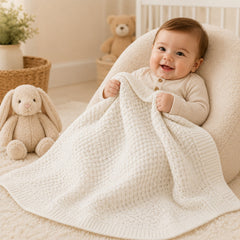 Baby wrapped in beige waffle cotton thermal blanket