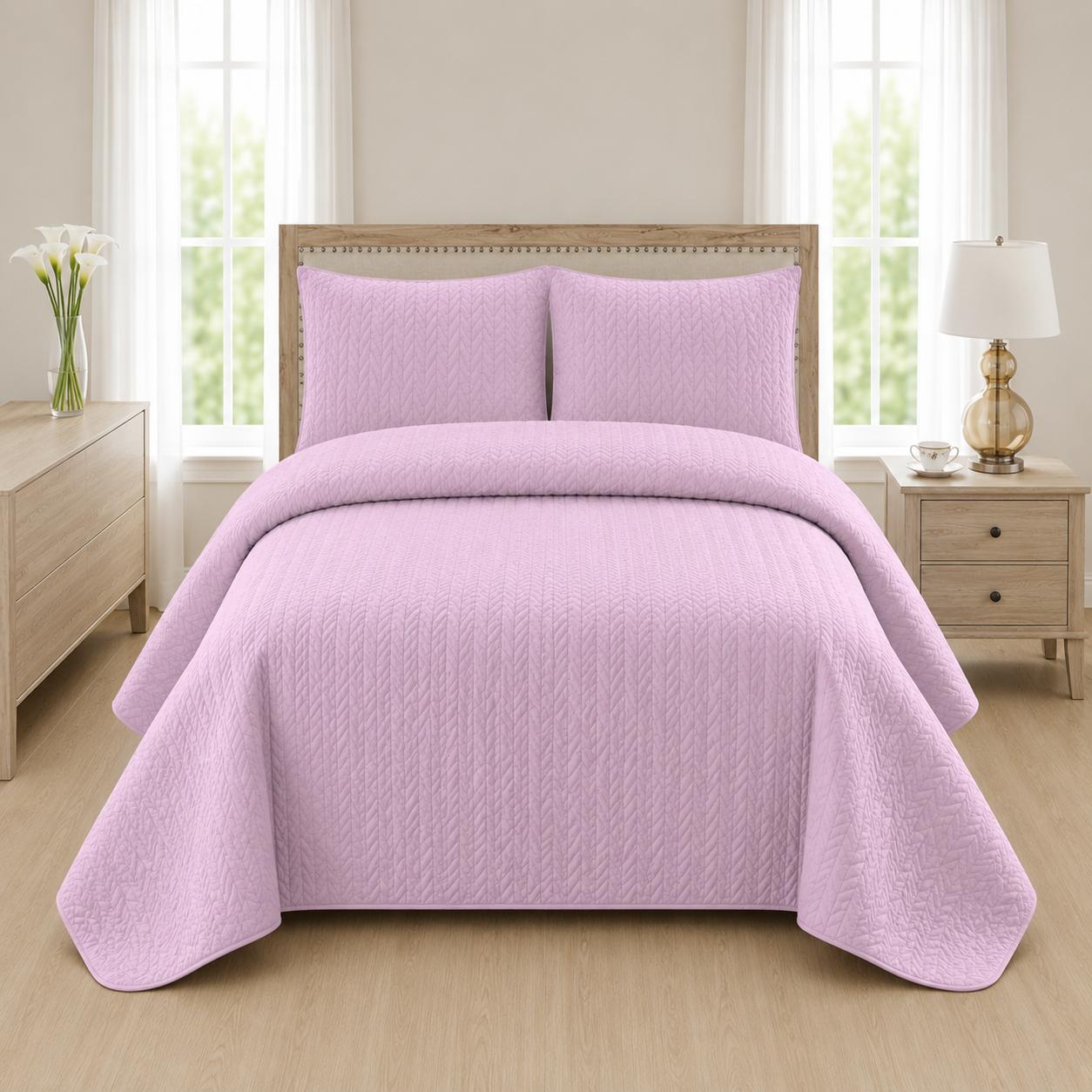 Lilac quilted bedspread styled on a bed in a cosy neutral bedroom