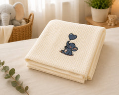The Idea cream cotton baby blanket with embroidered elephant and heart balloon