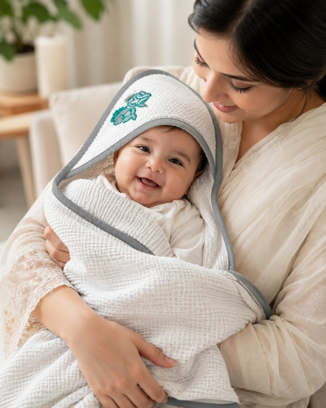 Close up of the teal fish embroidery on the towel hood