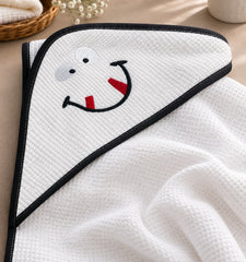 White cotton hooded baby towel with happy face embroidery and dark contrast trim