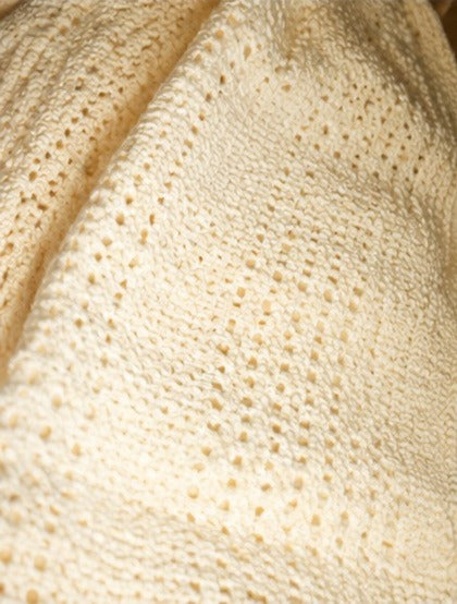 Close up of lemon cellular cotton weave