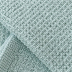 Close up of mint waffle cotton weave