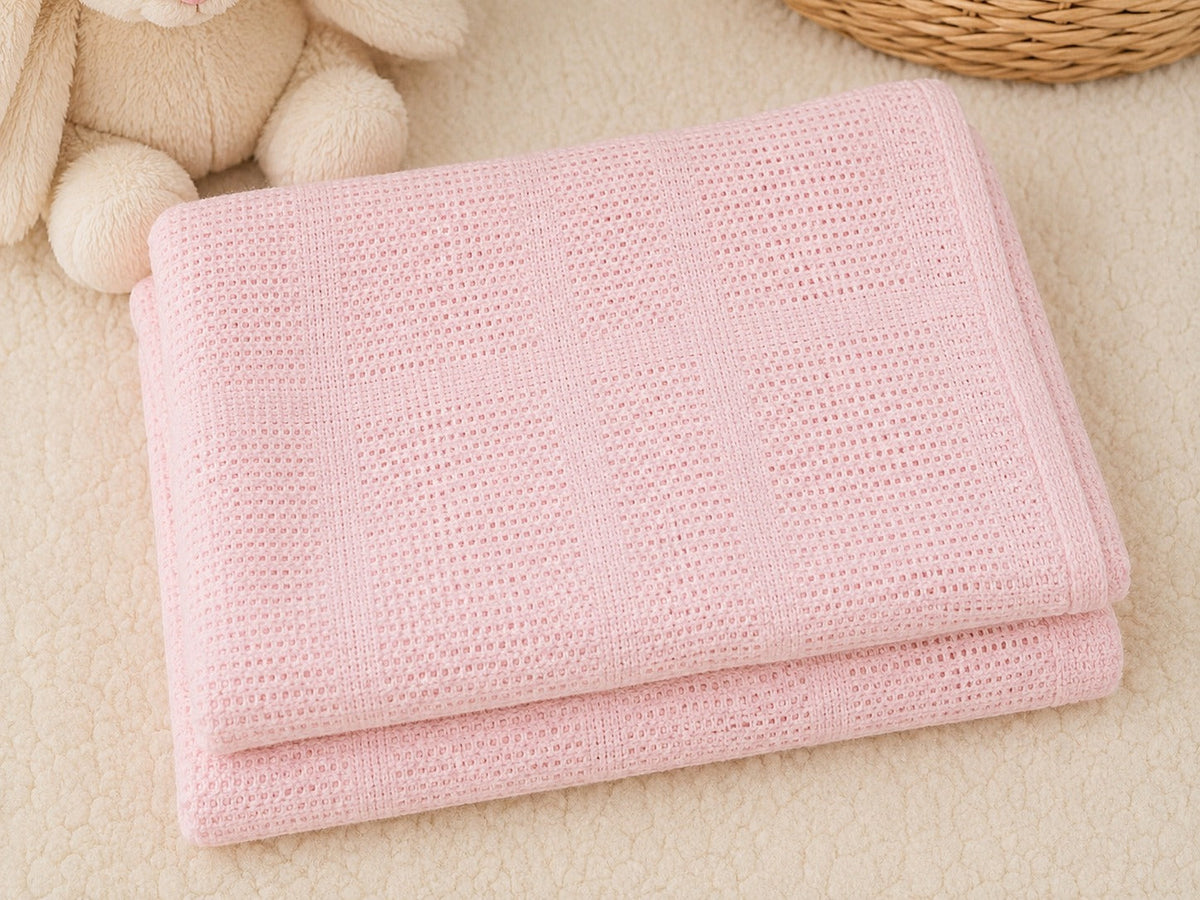 Pink cellular cotton baby blanket folded