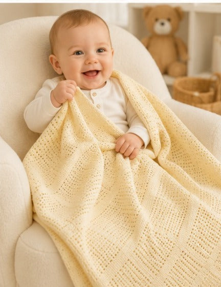 Baby wrapped in lemon cellular cotton blanket